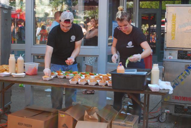 AK Bombers had a slider assembly station at Taste of Madison. They boasted of being one of Travel Channel's Food Wars champions.