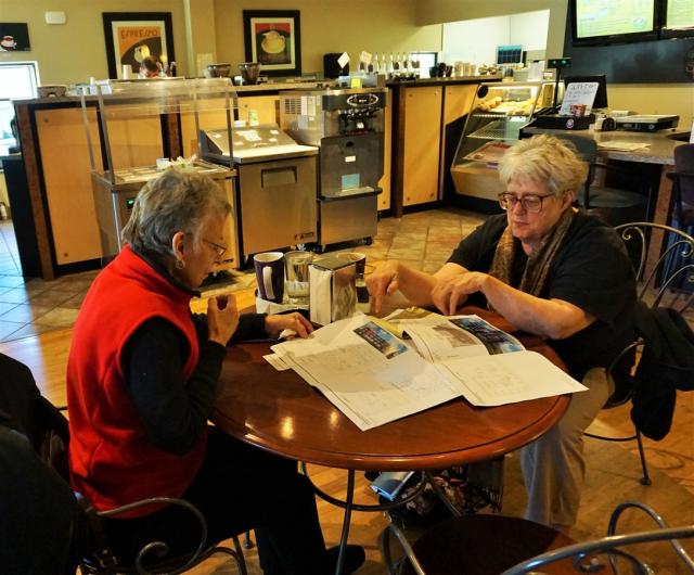 Pat Morgan and Dolores Kester, both of the Sherman Neighborhood Association, review a developer's plans for two Northside sites. (Cara Lombardo/Madison Commons)