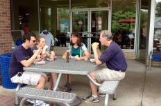 A Madison family enjoys hot dogs outside of Willy Street Co-op.