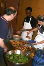 Tenth grader Ali Hassa (left) and Manona Thompson serve a Slow Food meal at Goodman