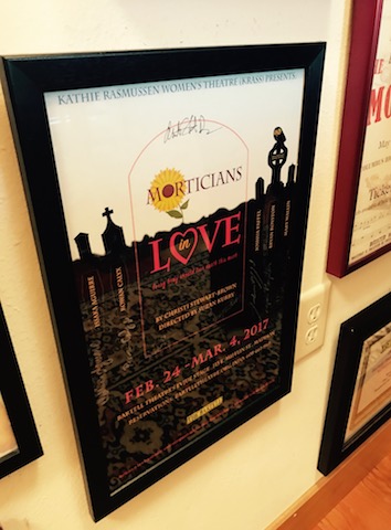 A poster hanging in Thal’s home from the cover art of Krass’s Spring 2017 production of Morticians in Love by Christi Stewart-Brown (Maki Watanabe/Madison Commons).