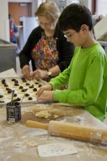 Max Roquitte, right, and Ruth Roquitte prepare hamantaschen for Sunday's Purim Carnival at Temple Beth El (Kait Vosswinkel/Madison Commons)