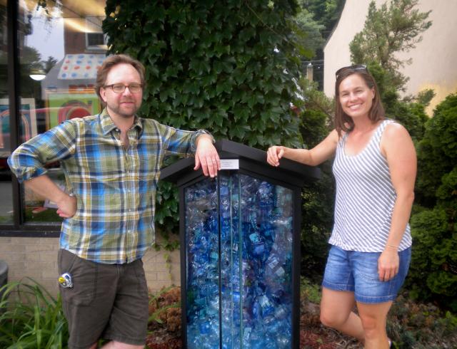 Little Galleries founders Jeremy Wineberg, left, and Rachel Bruya pose outside the Little Galleries location on Monroe Street. The project seeks to put art in unexpected locations (Abby Becker/Madison Commons).