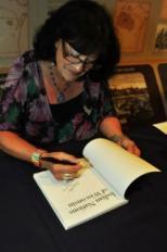 UW-Madison Professor of Life Sciences Communication Patty Loew signs her new book 