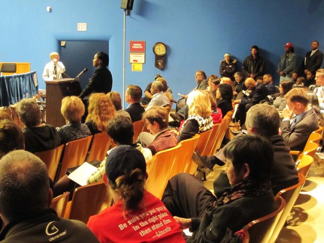 Community members pack the auditorium at the Board of Education meeting