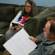 Playwright Mary Dexter listens at the table read for her play, 
