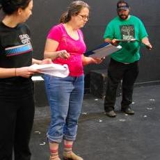 Mary Dexter, middle, works with Emily Cauthen, left, and Andy Lindgren, right, actors during a rehearsal for 