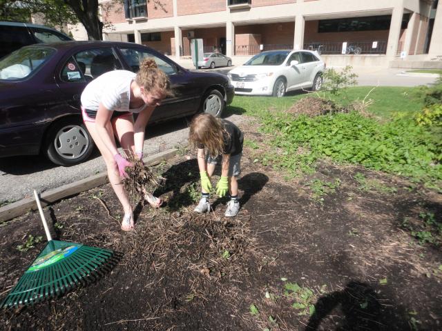 College student Lauren Raab works with an area kid as part of Neighborhood House's college mentoring program (Courtesy: Neighborhood House)