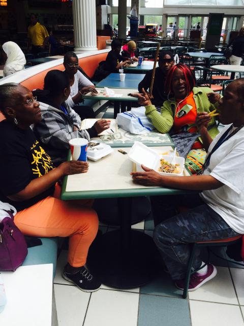 Members of the Mothers in the Neighborhood group talk over lunch at West Towne Mall. They are part of a program to help share information about diabetes in South Madison (Franco Latona/Madison Commons).