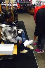 Andrea Hatley and Daphne Maymon try on shoes inside Finish Line at West Towne Mall (Franco Latona/Madison Commons).