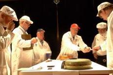 Judges assess one of 16 cheeses in the contest's final round.