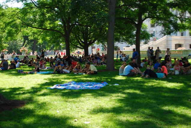 Diners enjoy a picnic in the shade