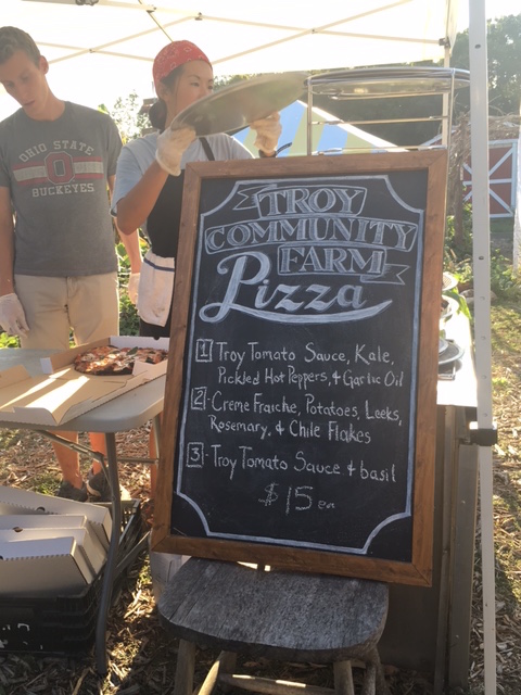 Chalkboard listing the menu and ingredients available for the week’s pizza night. (Laura Schmitt/Madison Commons)