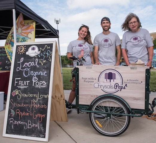 (Chrysalis Pops employees setting up at a local farmers market/Chrysalis Pops)