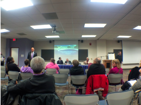 President Daniels introduces the history and background of the new education program. (Claire VanValkenburg/Madison Commons)