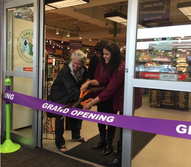 Anya Firszt, Patricia Butler and Abha Thakkar share the honor of cutting the ribbon. (Melissa Behling/Madison Commons)