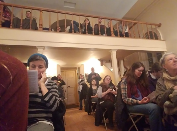 Attendees stood at the rear of the Synagogue to listen to the readers. (Claire VanValkenburg/Madison Commons)