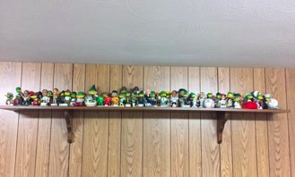 (Madison Mallards bobble heads from over the years in the Endres’ basement room)