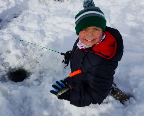 TJ Hutchins with his first catch of the day (Pawan Naidu/Madison Commons)