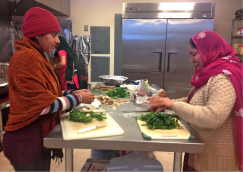 Sikh worshipers cooking together