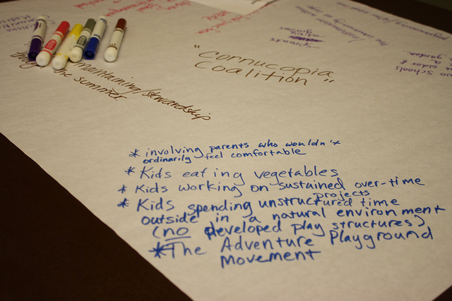 In one workshop, attendees scribbled down ideas for promoting and sustaining school gardens.