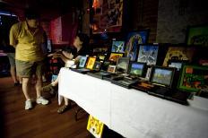 Dozens of painters, jewelers, ceramicists and other local artists filled the High Noon Saloon on Sunday during the first annual Madison Womyn's Music &amp; Art Festival (Kait Vosswinkel/Madison Commons).