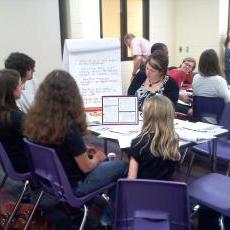 Attendees of a MMSD input session discuss the merits and limitations of the achievement gap plan