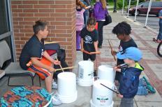 Kids drumming at Eat Play Bike