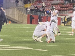 Senior teammates after the final buzzer of the state football championship.