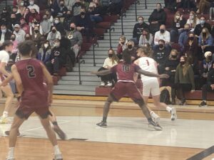 La Follette’s K’Shawn Gibbs defending Middleton’s Gavyn Hurley in boys basketball.