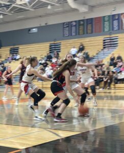 Sun Prairie’s Rademacher drives into the paint against Arrowhead.