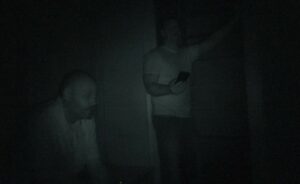 Scott Timm (left) and Jason Bertram (right) during a paranormal investigation.