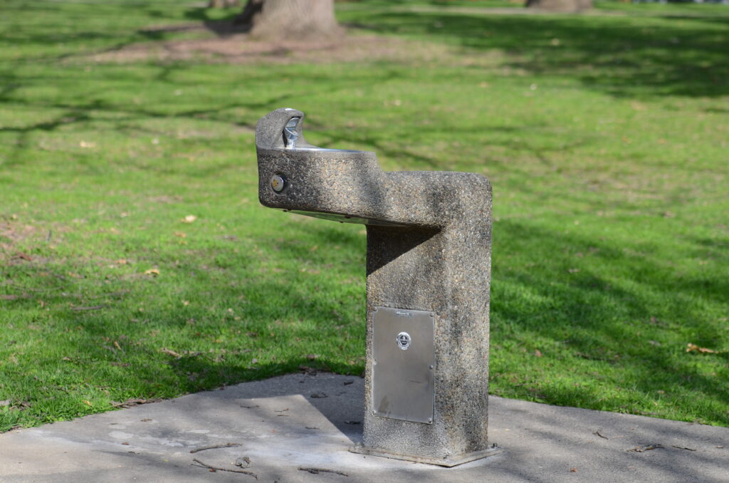 A “bubbler” on Orton Park’s west side signifies the return of summer when its water supply is shut on.