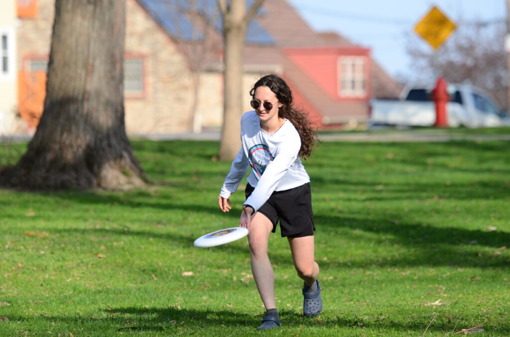 Mickela Heilicher catches a frisbee at Orton Park in Madison, Wis. on May 9, 2022.