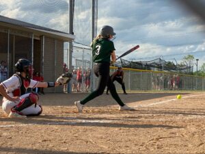 Madison Memorial’s Hailey Ruff hits a ground ball to third base.