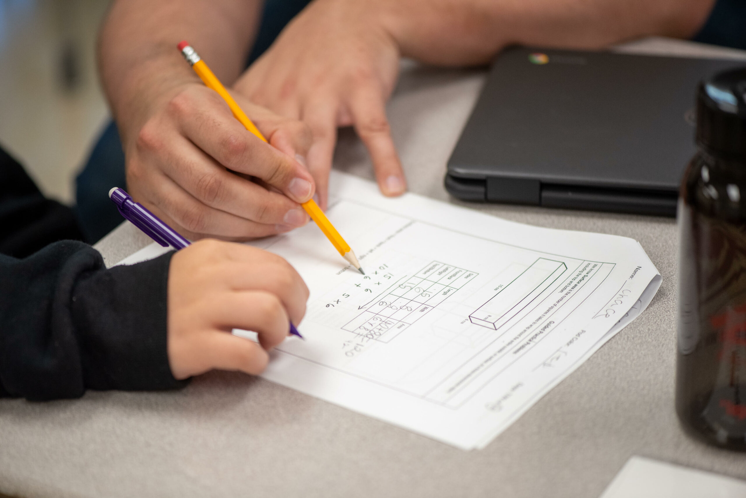 Teacher working with student 