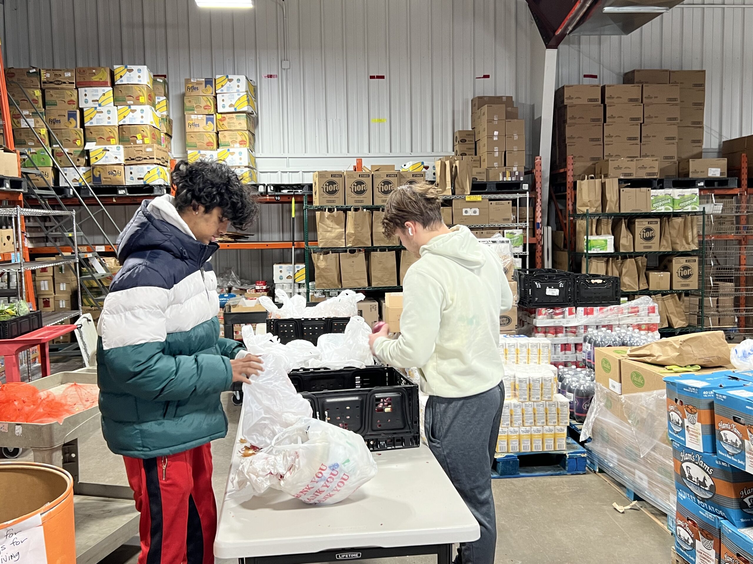 Volunteers work at Middleton Outreach Ministry food pantry the week before Thanksgiving