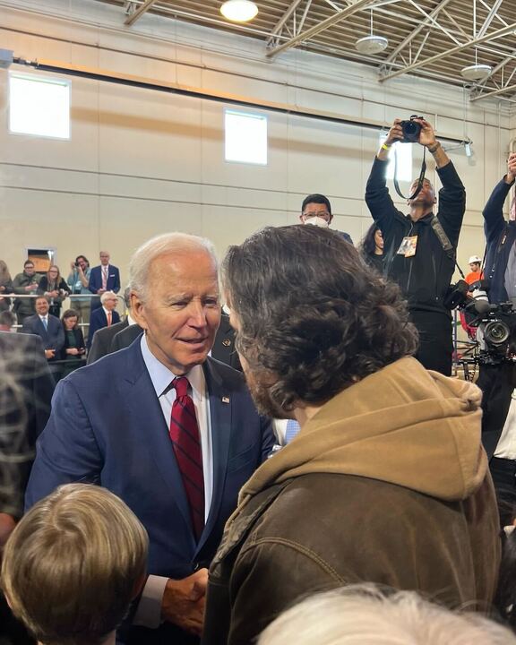 President Joe Biden greets a guest at LIUNA, which stands for Laborers’ International Union of North America in DeForest, Wisconsin. Biden visited the Madison area to promote his job creation plan, which he said had led to thousands of new jobs.