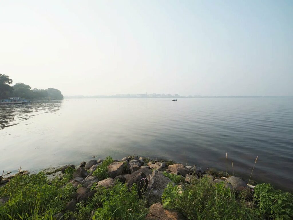 The Madison skyline is barely visible across Lake Monona through haze from wildfire smoke from Canada.