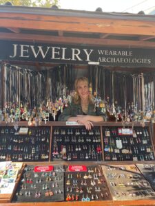 Jeweler Hanna Brettner smiling in her mobile jewelry cart.