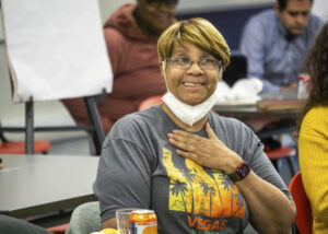 Odyssey Project graduate Mary Wells reacting to a screening of a documentary video exploring the Family Scholar House concept. Photo by Jonás Tijerino.