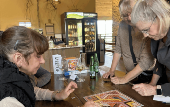 Women working on a puzzle together