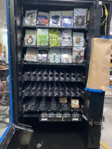 The vending machine being used by ArtWorking in their booth at the Madison Public Market. The machine will house a rotation of artworks by 48 different in house artists, which will change out every couple weeks.