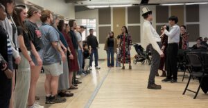 Attendees at the Nauryz celebration line up to learn a traditional Kazakh dance.