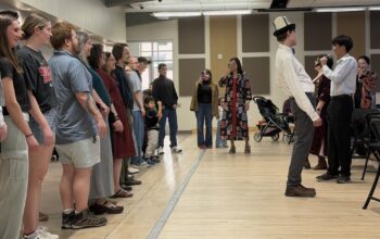Attendees at the Nauryz celebration line up to learn a traditional Kazakh dance.