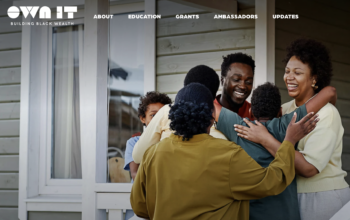 A crowd of people hug each other at the entrance to a home